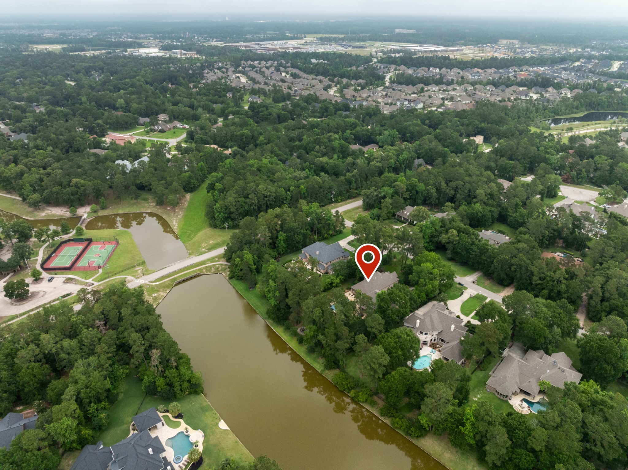 28227 KAILEES Court Spring, TX 77386 - Photo 46 of 48 Located on prestigious Kailees Court, one of the most sought-after streets in Benders Landing. Enjoy true waterfront living—fish from your backyard or launch a canoe or kayak onto the fully stocked lake.