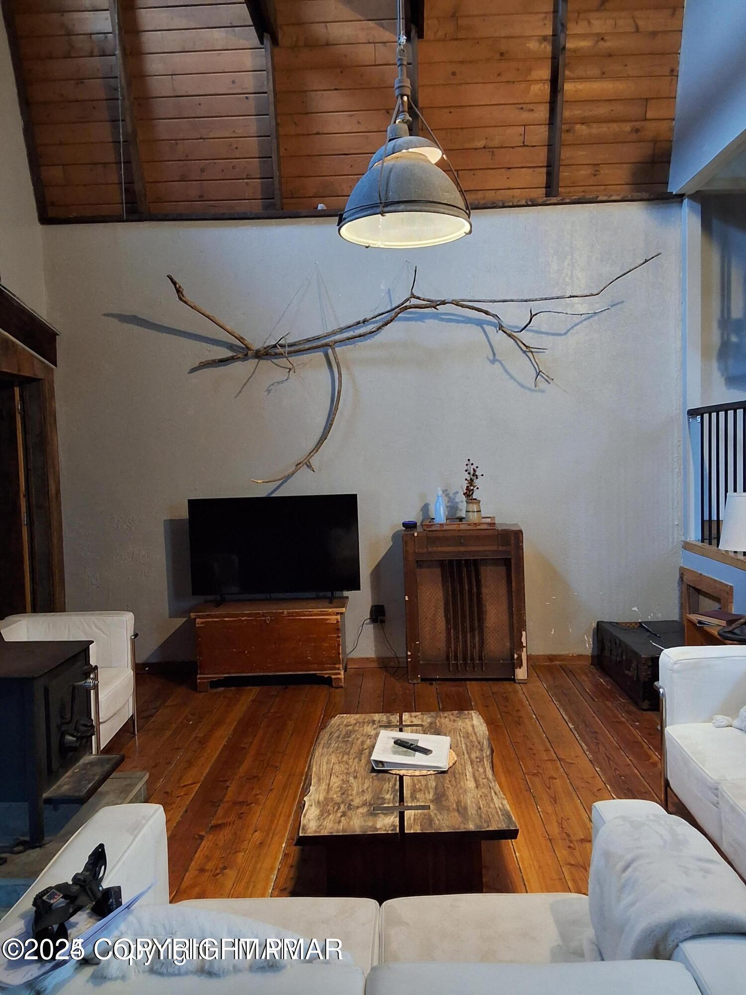 169 Saunders Drive Bushkill, PA 18324 - Photo 30 of 100 a living room with furniture and a fireplace
