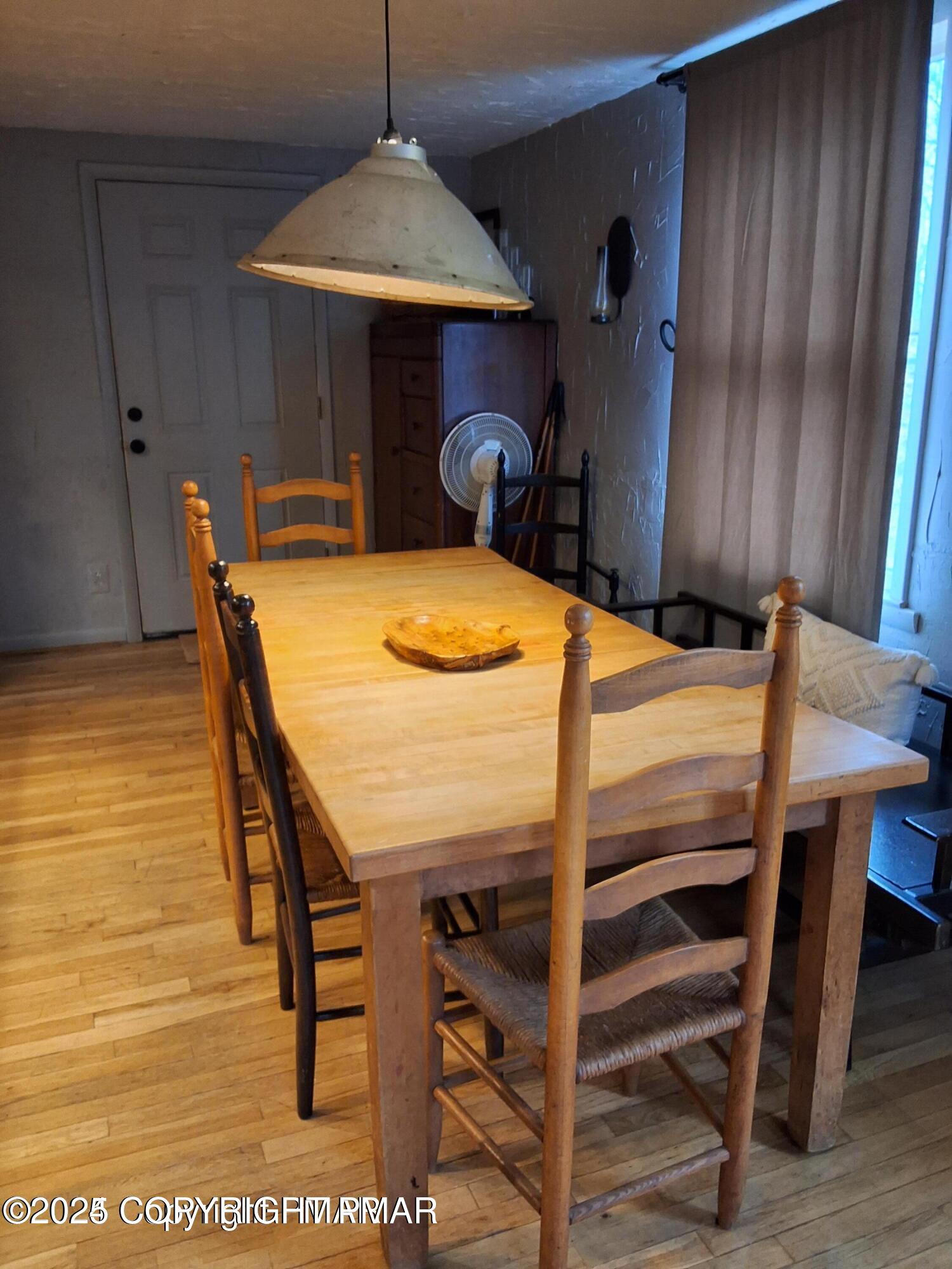 169 Saunders Drive Bushkill, PA 18324 - Photo 47 of 100 a dining room with furniture and wooden floor