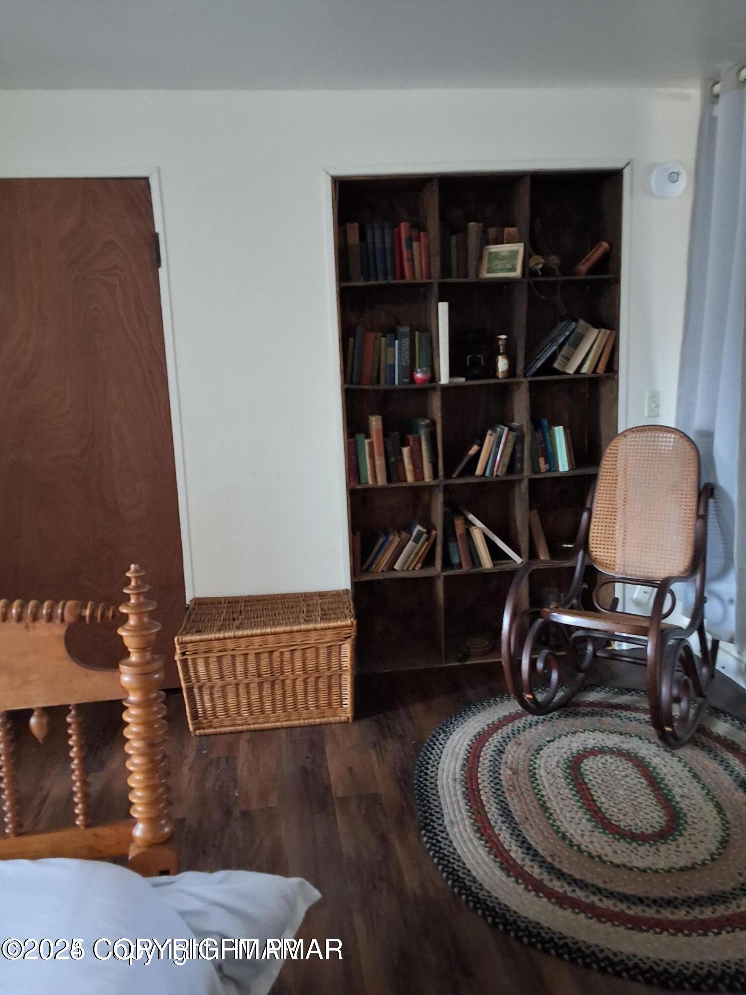 169 Saunders Drive Bushkill, PA 18324 - Photo 58 of 100 a room with bookshelf and wooden floor