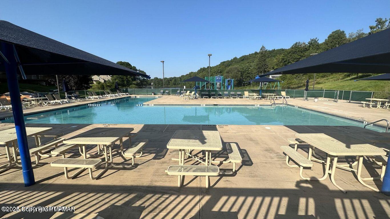 169 Saunders Drive Bushkill, PA 18324 - Photo 74 of 100 a view of a backyard with sitting area