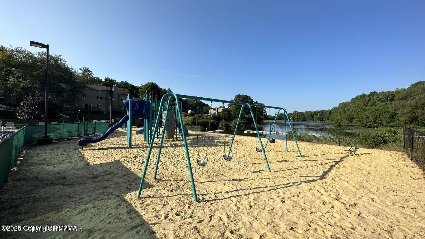 169 Saunders Drive Bushkill, PA 18324 - Photo 96 of 100 a view of swimming pool with a garden