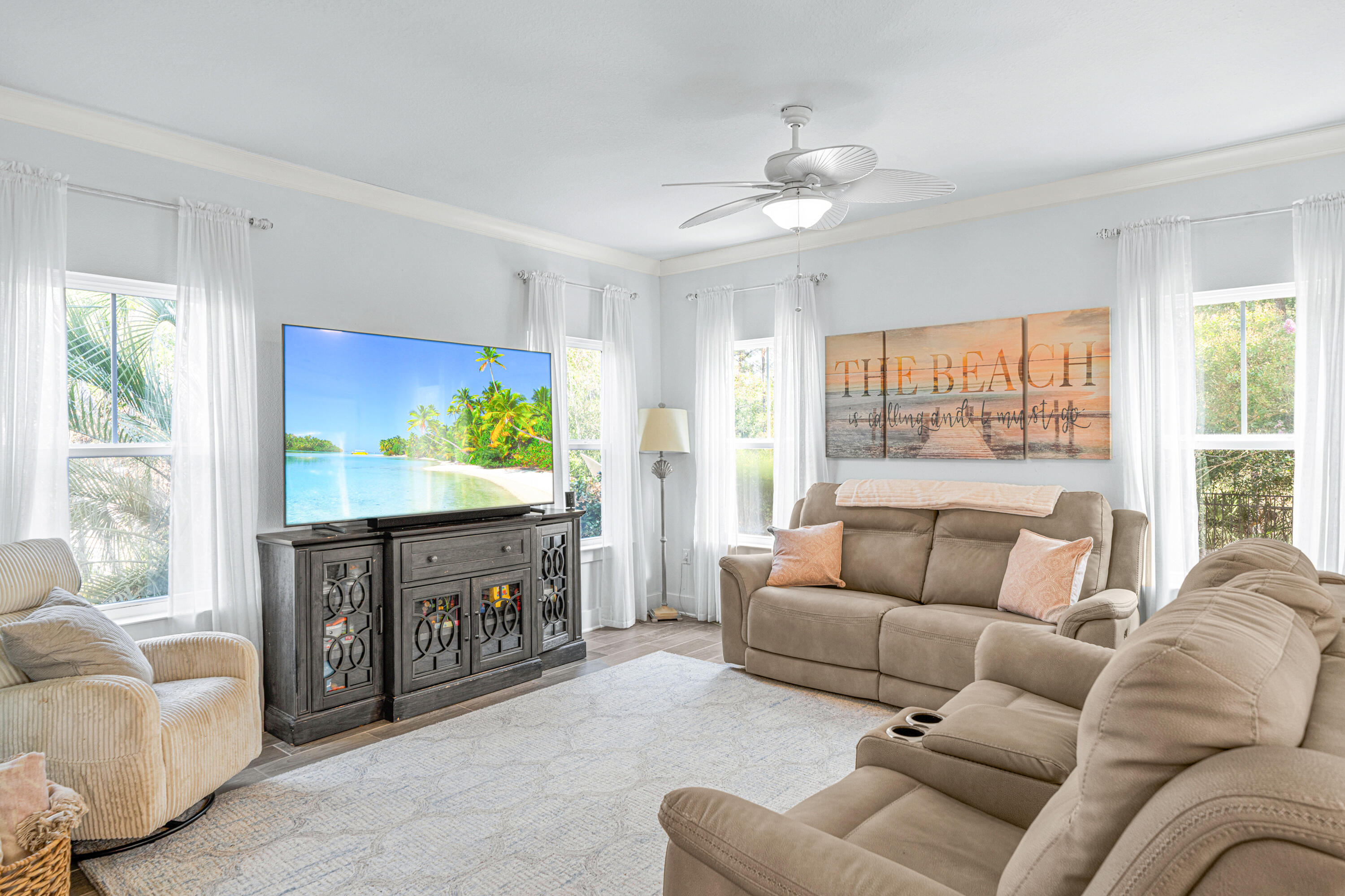 178 Melrose Avenue Santa Rosa Beach, FL 32459 - Photo 13 of 45 a living room with furniture a large window and a flat screen tv