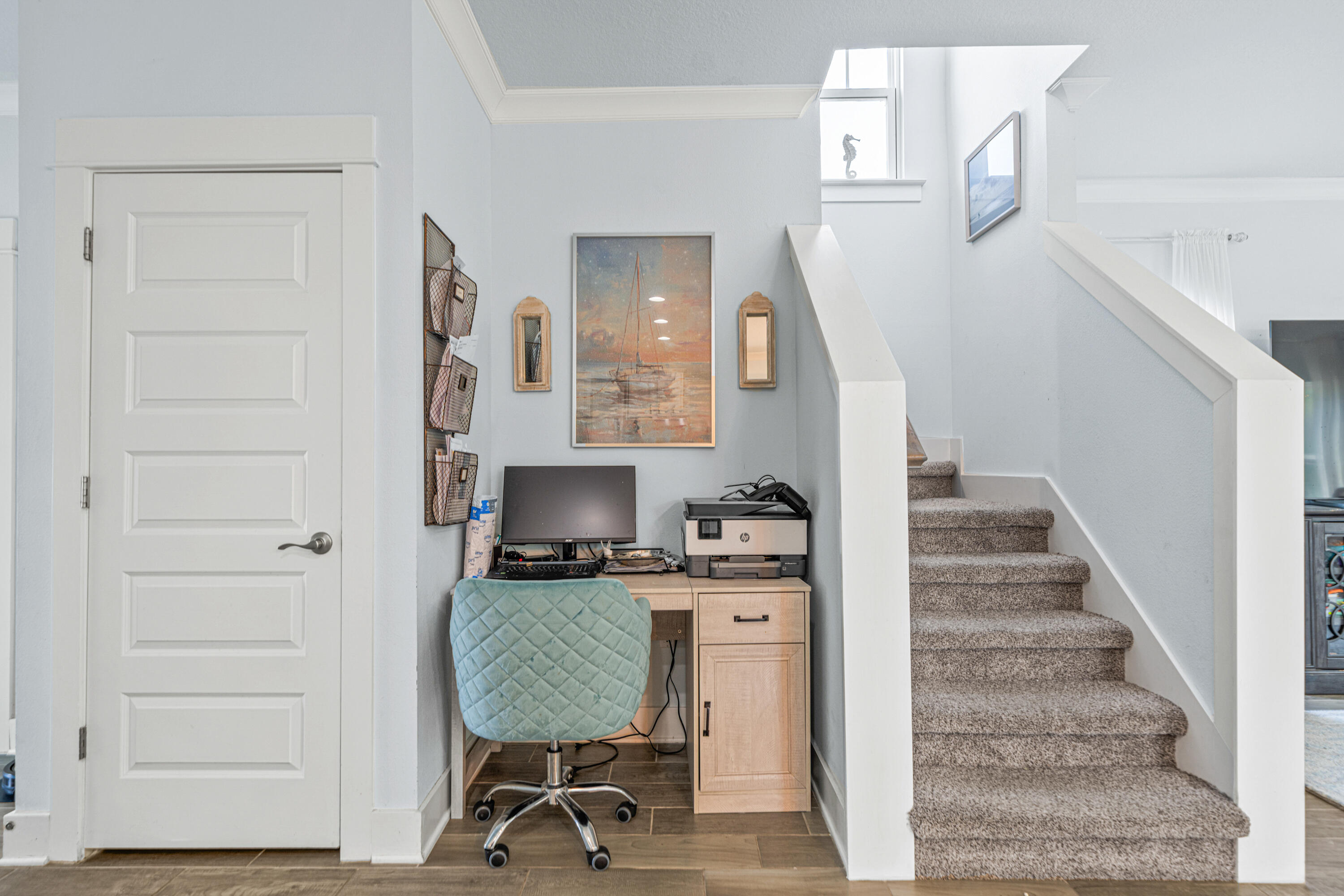 178 Melrose Avenue Santa Rosa Beach, FL 32459 - Photo 17 of 45 a view of a hallway with workspace and wooden floor