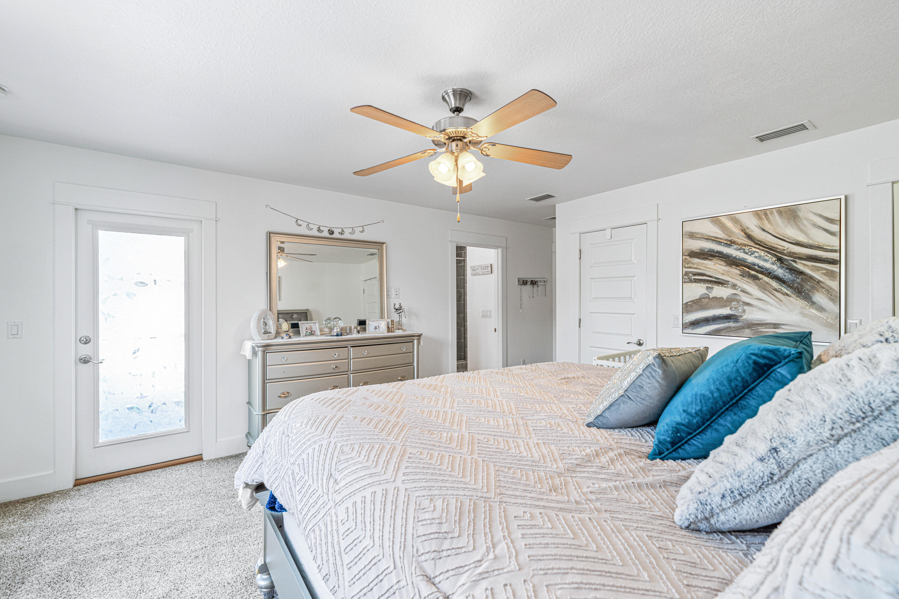 178 Melrose Avenue Santa Rosa Beach, FL 32459 - Photo 20 of 45 a bedroom with a bed and a chandelier