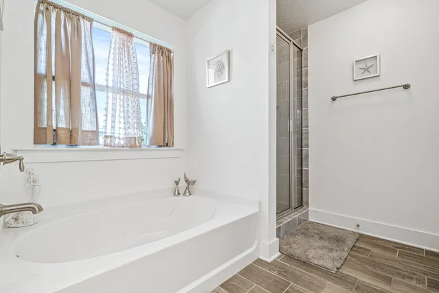 a white bath tub sitting next to a window
