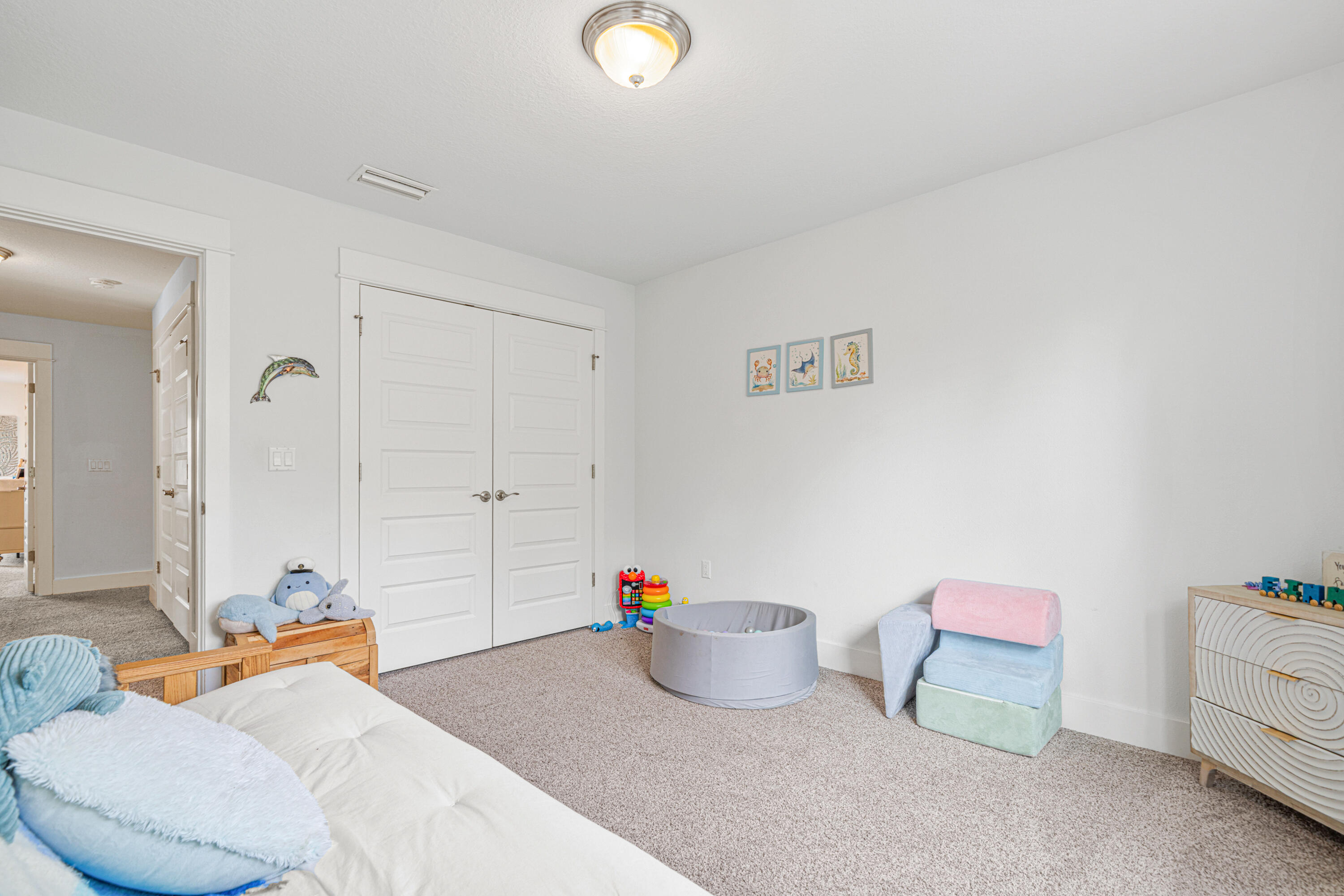 178 Melrose Avenue Santa Rosa Beach, FL 32459 - Photo 31 of 45 a bedroom with furniture and a potted plant