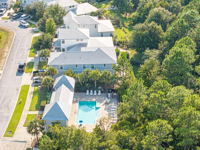 an aerial view of residential house with outdoor space and swimming pool