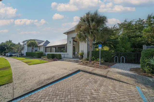 a view of backyard with swimming pool and outdoor seating