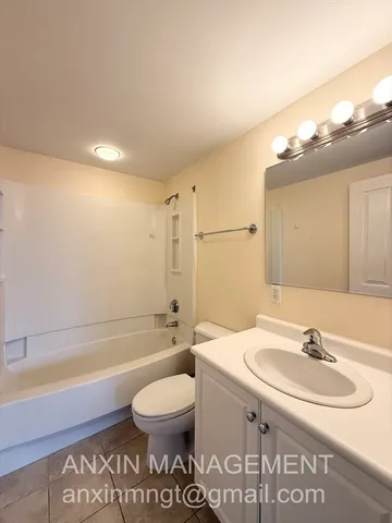 a bathroom with a sink a toilet and a bathtub