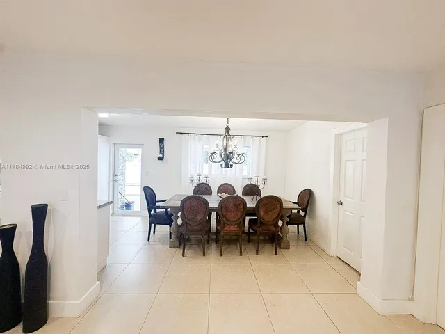 a view of a dining area with furniture window and outside view