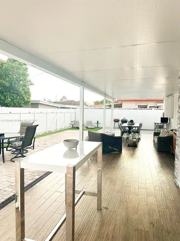 a swimming pool with outdoor seating and outdoor space