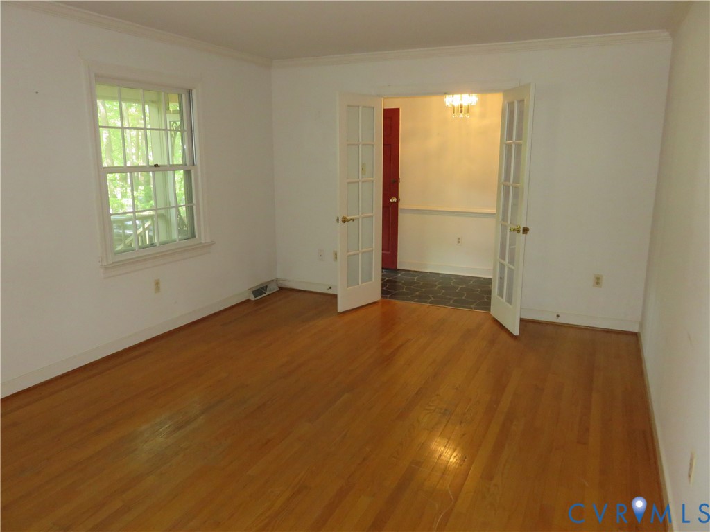 8379 Quailfield Road Mechanicsville, VA 23116 - Photo 16 of 56 a view of an empty room with a window