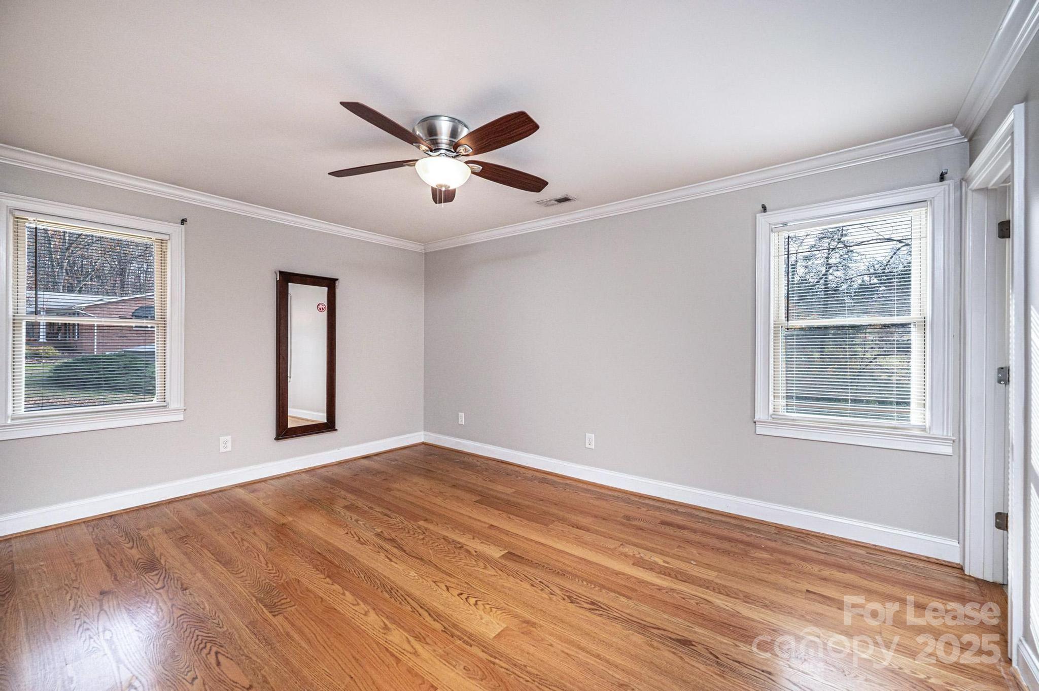 1060 26th Avenue Northeast Hickory, NC 28601 - Photo 16 of 29 a view of an empty room with wooden floor and a window