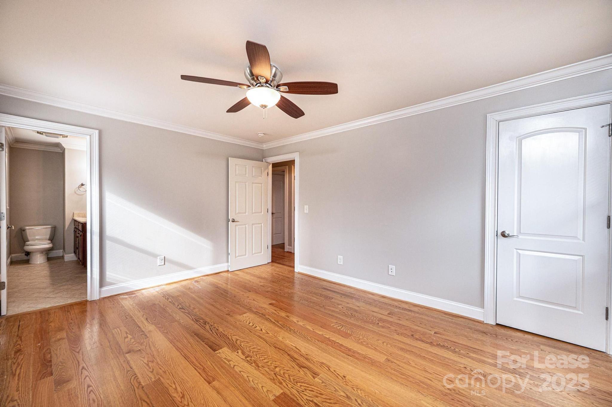 1060 26th Avenue Northeast Hickory, NC 28601 - Photo 17 of 29 a view of empty room with wooden floor and fan