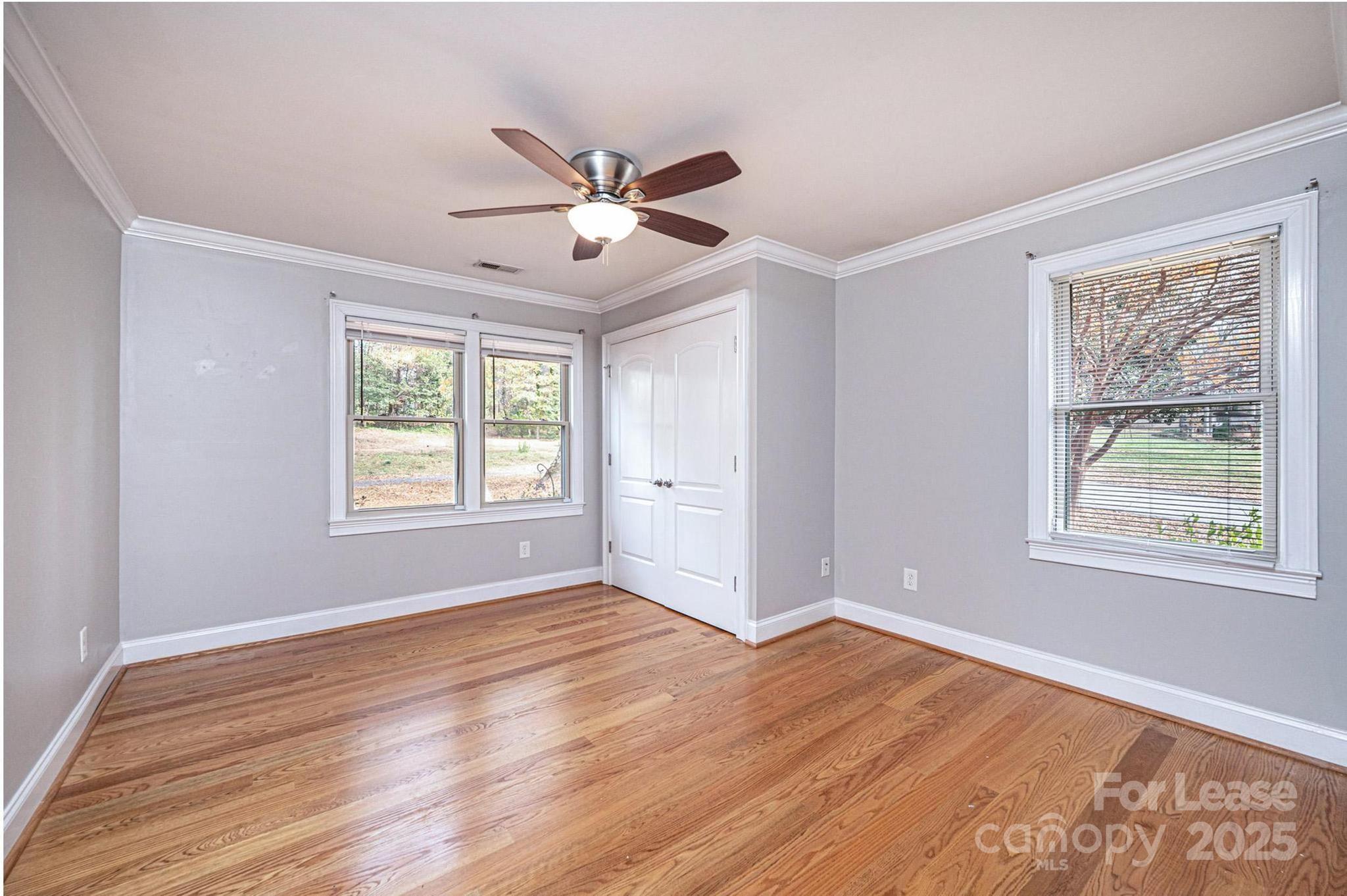 1060 26th Avenue Northeast Hickory, NC 28601 - Photo 20 of 29 a view of an empty room with wooden floor and a window