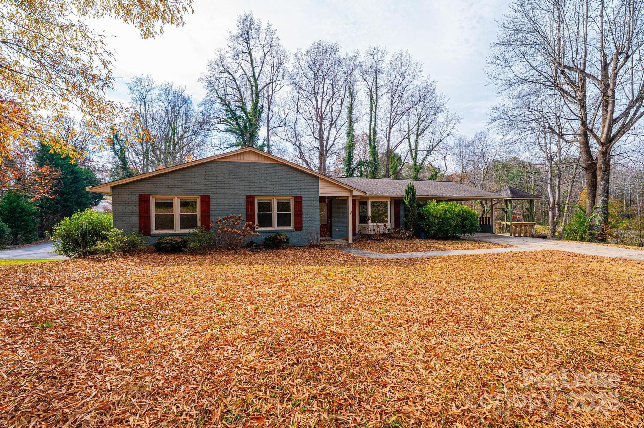 1060 26th Avenue Northeast Hickory, NC 28601 - Photo 2 of 29 a front view of house with yard and trees in the background