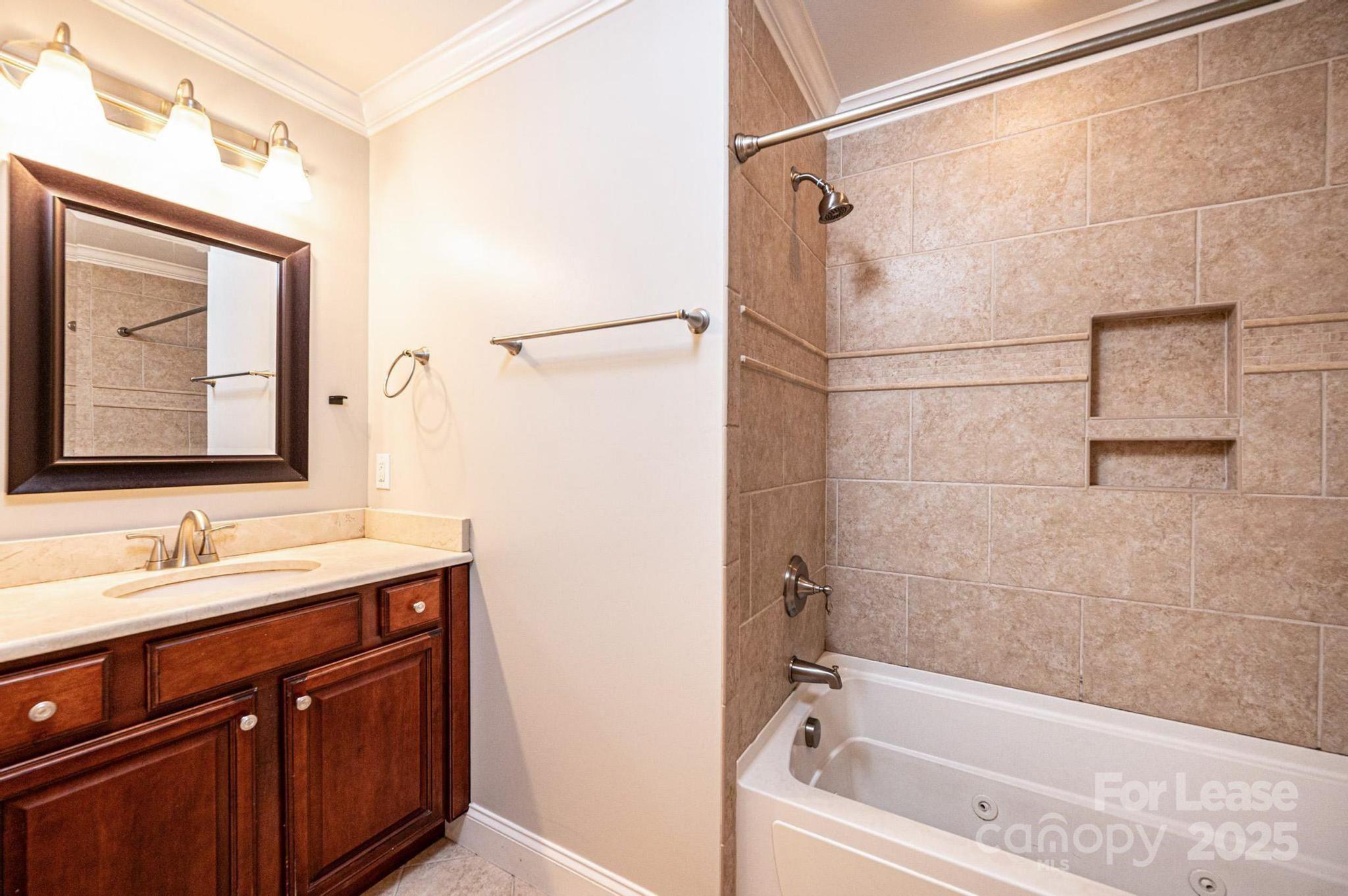 1060 26th Avenue Northeast Hickory, NC 28601 - Photo 26 of 29 a bathroom with a bathtub and a sink