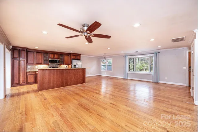 a view of a kitchen with a sink and a window