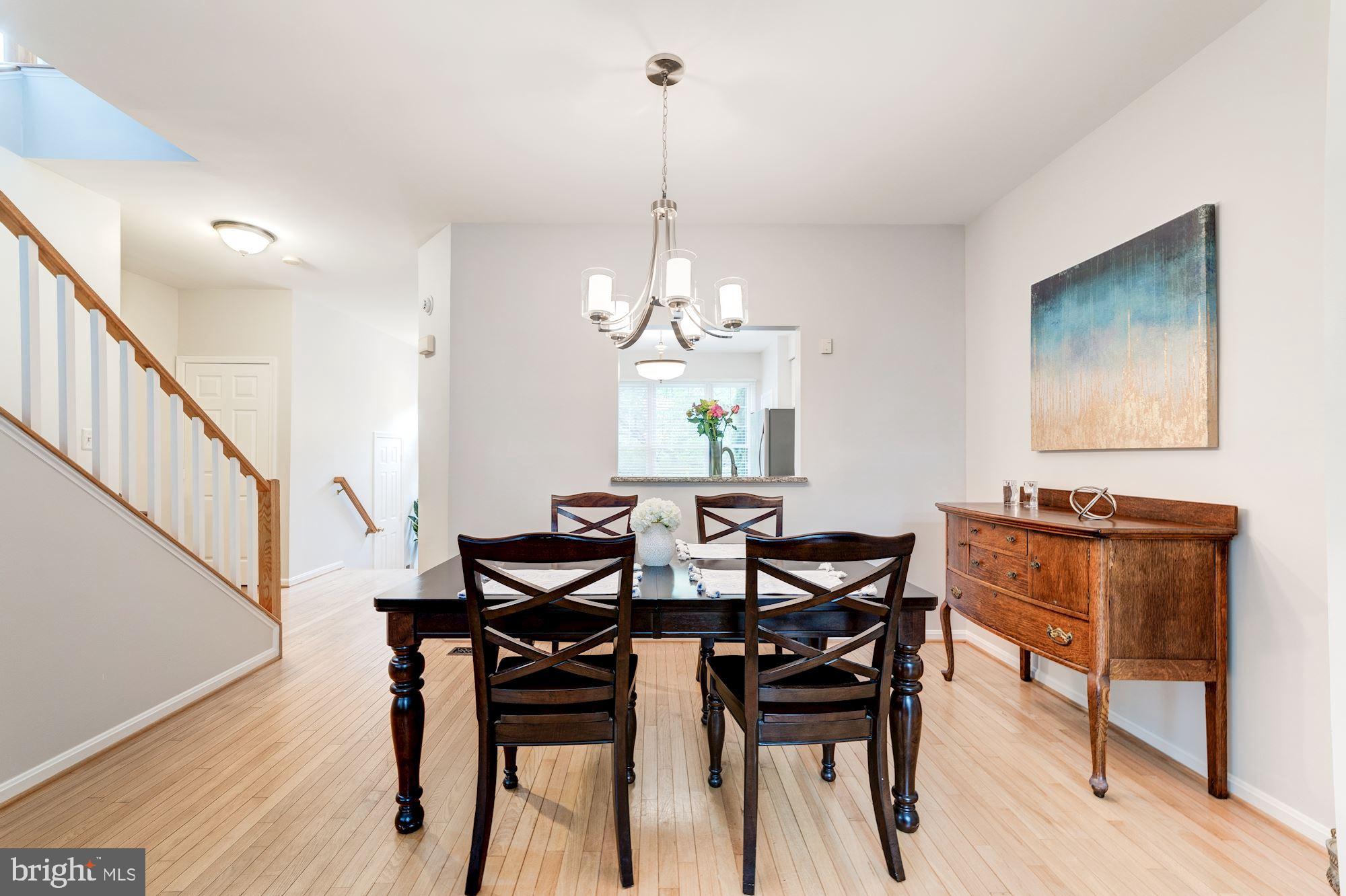 1283 Weatherstone Court Reston, VA 20194 - Photo 11 of 38 a view of a dining room with furniture window and wooden floor