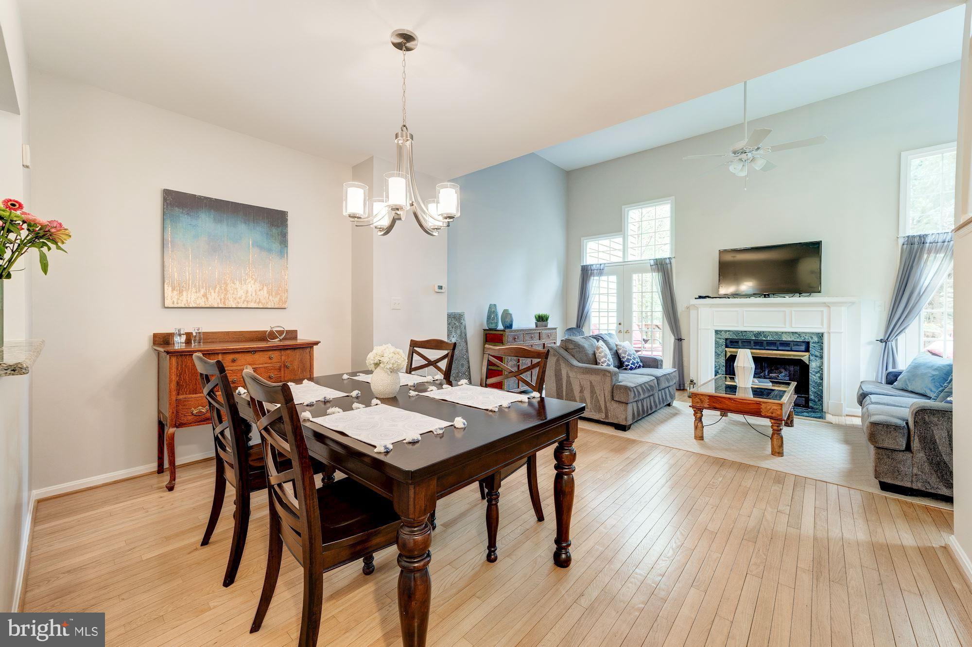1283 Weatherstone Court Reston, VA 20194 - Photo 12 of 38 a view of a livingroom with furniture window and wooden floor