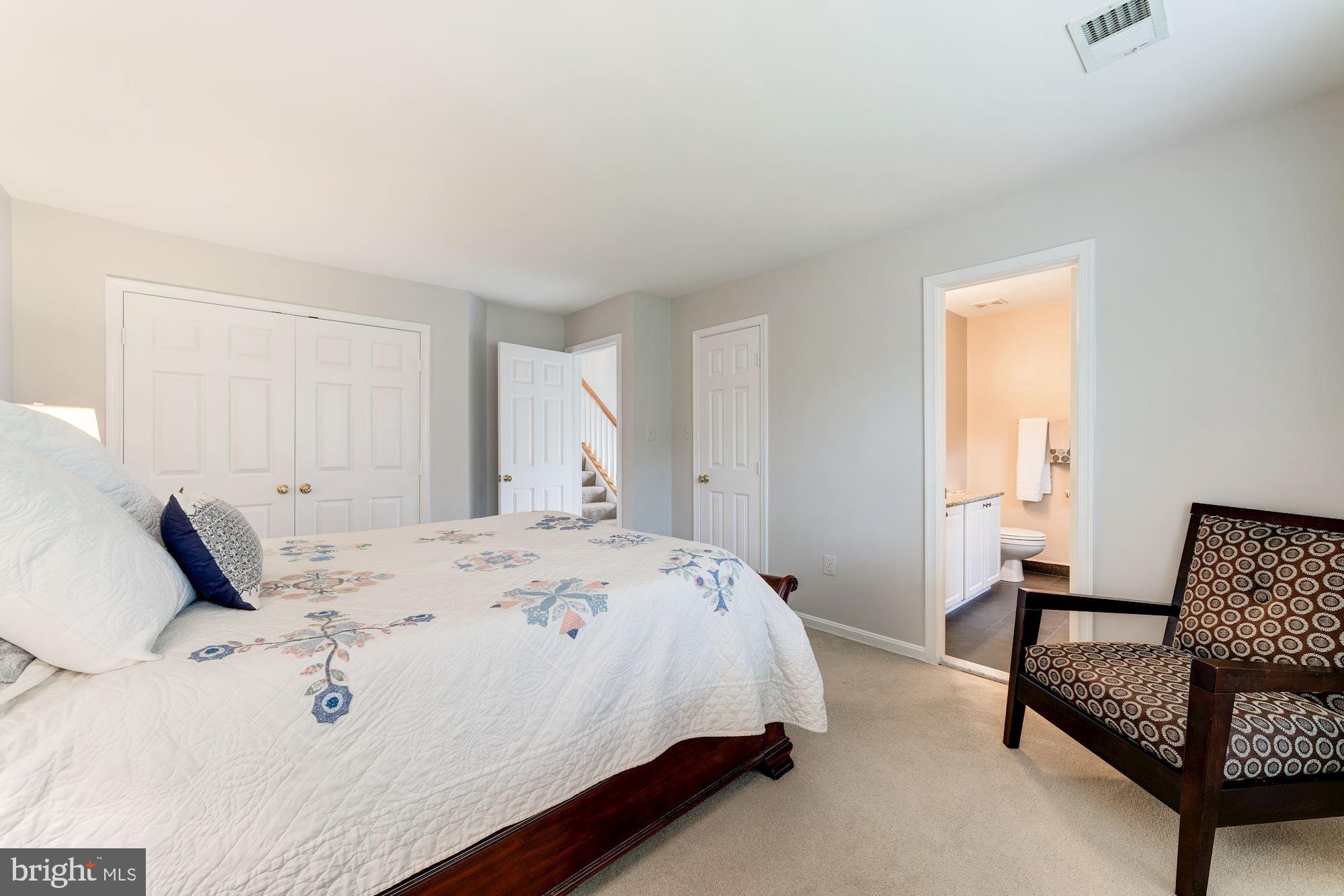 1283 Weatherstone Court Reston, VA 20194 - Photo 19 of 38 a bedroom with a bed and a couch
