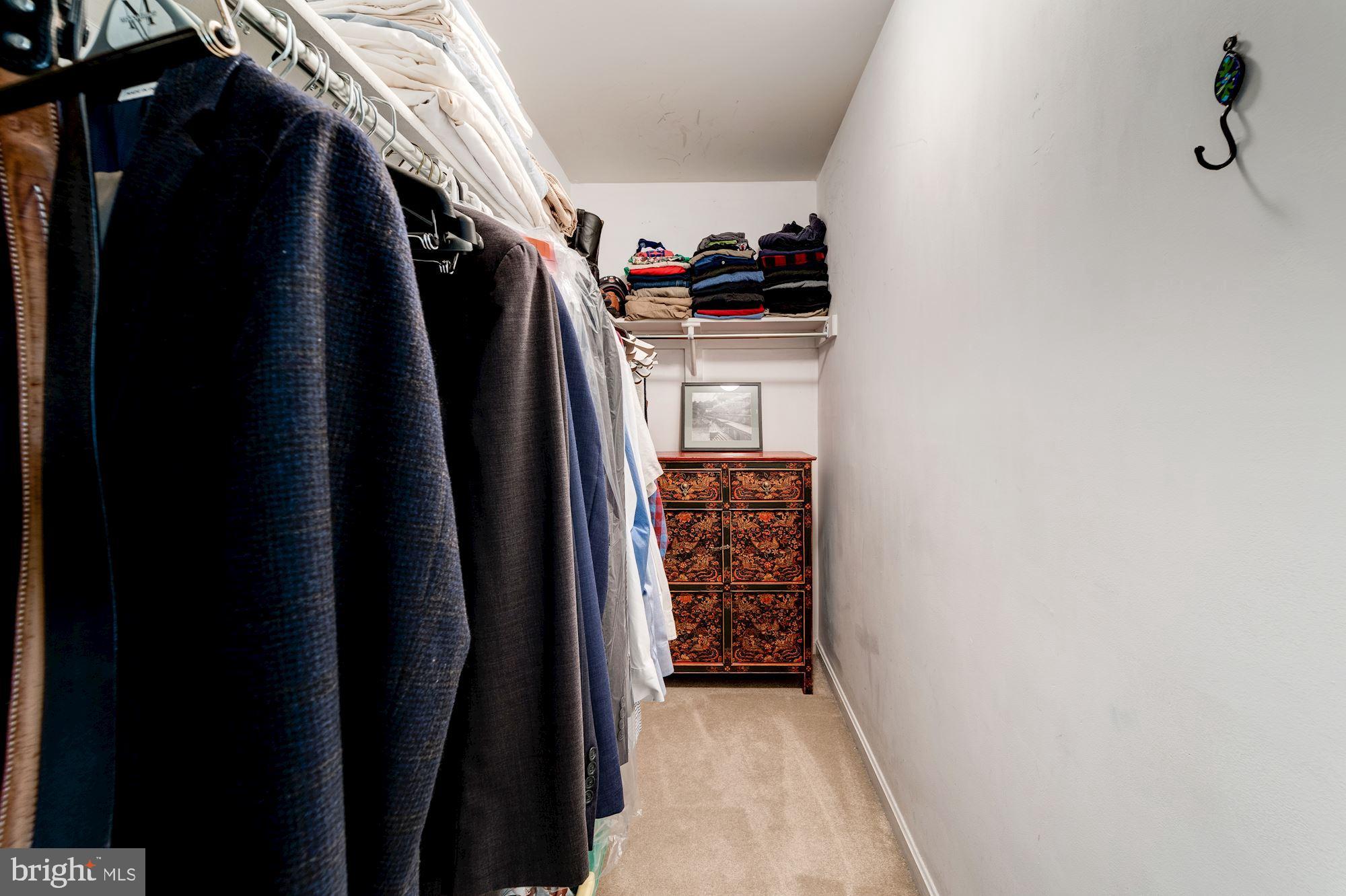 1283 Weatherstone Court Reston, VA 20194 - Photo 20 of 38 a view of walk in closet with clothes
