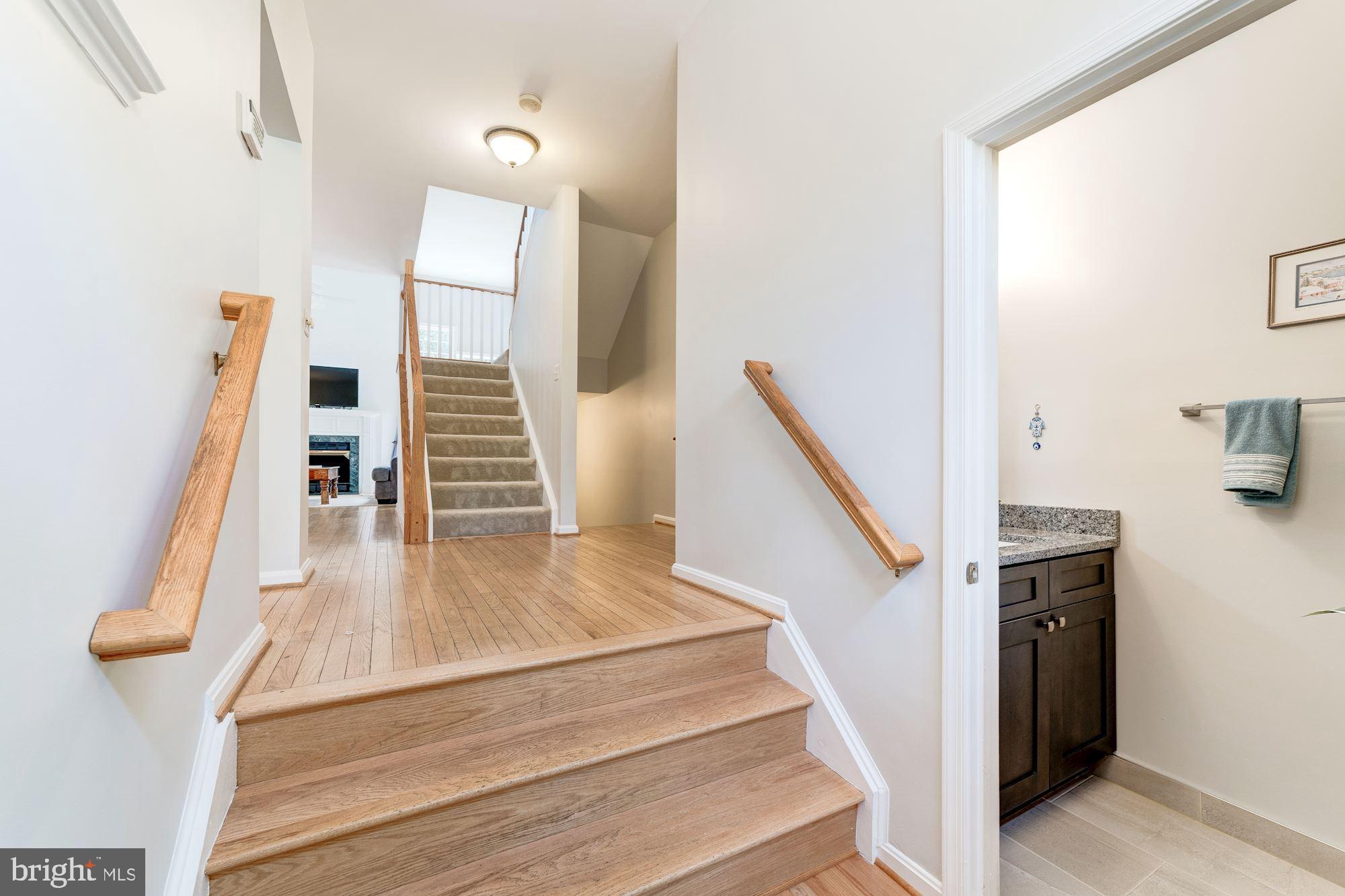 1283 Weatherstone Court Reston, VA 20194 - Photo 3 of 38 a view of entryway and hall with wooden floor