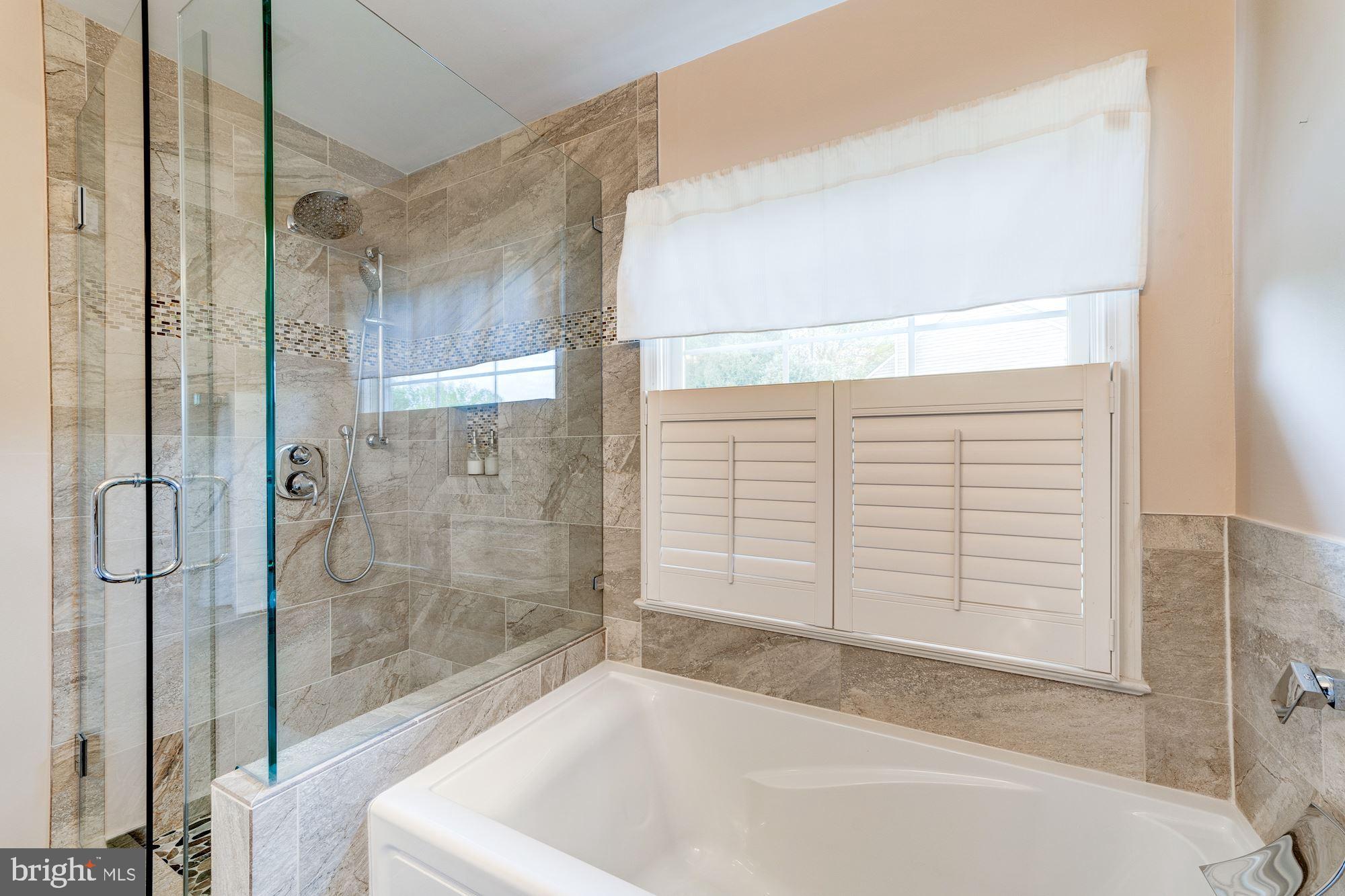 1283 Weatherstone Court Reston, VA 20194 - Photo 22 of 38 a bathroom with a bathtub and shower