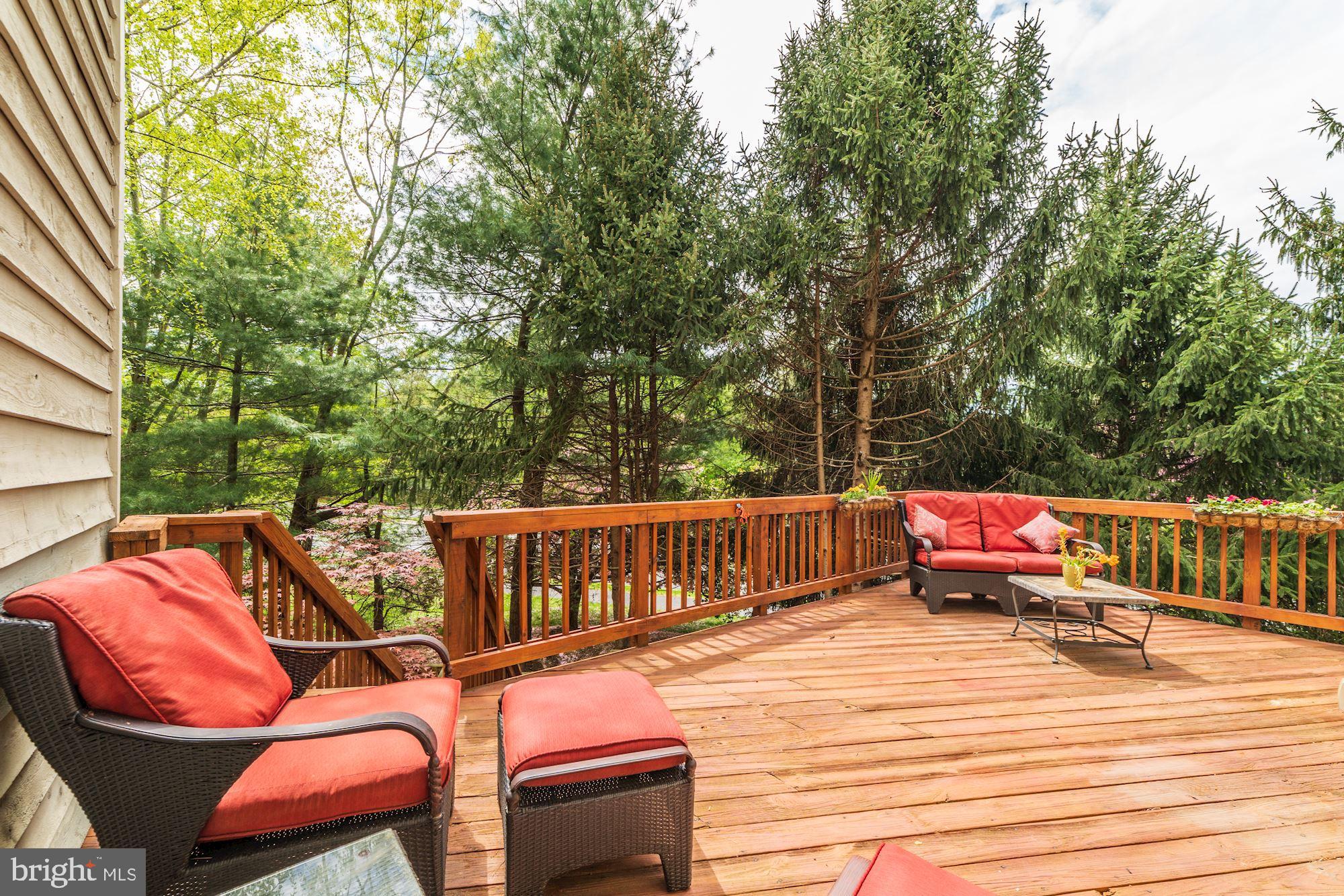 1283 Weatherstone Court Reston, VA 20194 - Photo 33 of 38 a balcony with wooden benches and couch