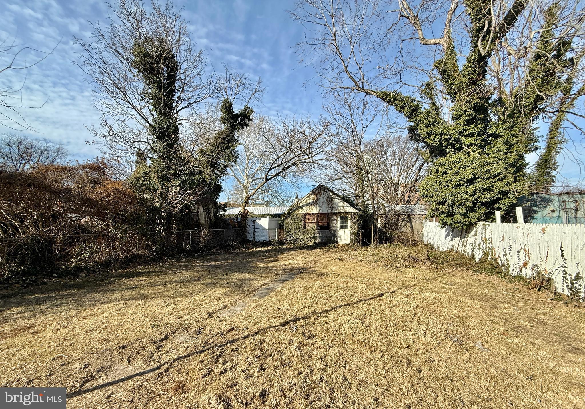 187 7th Street Salem, NJ 08079 - Photo 3 of 26 a view of the house with a yard covered with snow