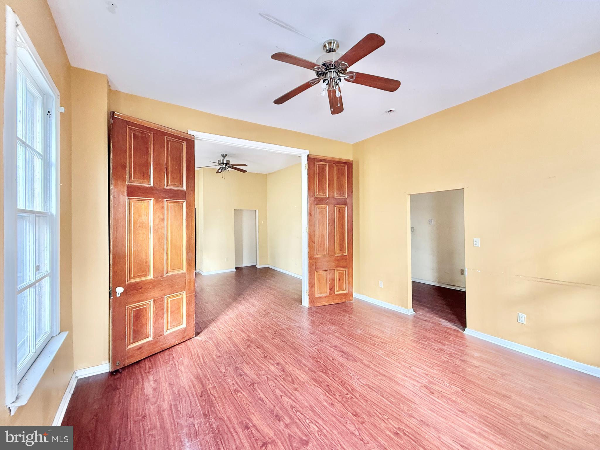 187 7th Street Salem, NJ 08079 - Photo 10 of 26 wooden floor in an empty room with a window