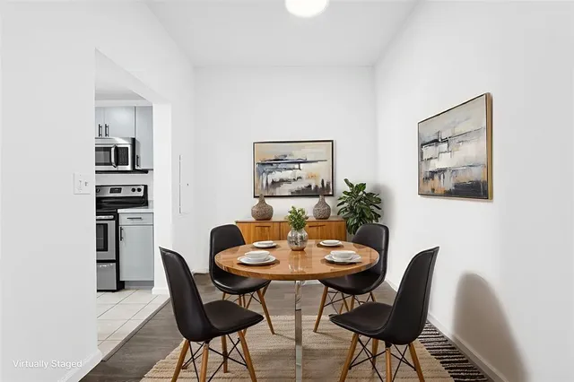 a kitchen with cabinets stainless steel appliances and a counter space