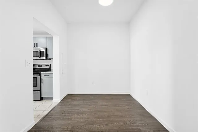a kitchen with stainless steel appliances kitchen island a refrigerator sink and stove