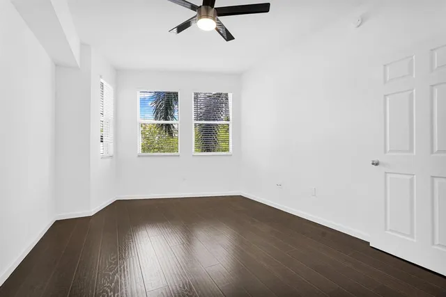 a bathroom with a sink and mirror with toilet