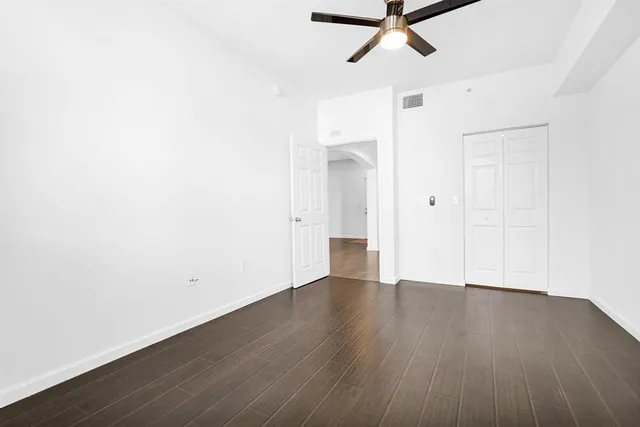 a room with gym equipment and view of living room