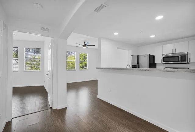 a view of a room with wooden floor and floors