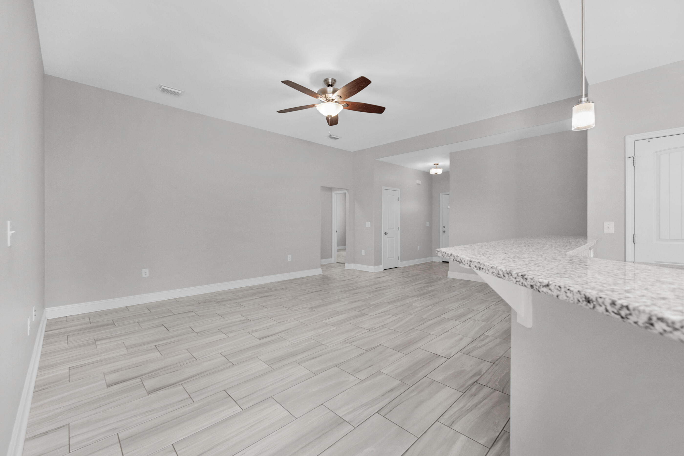 2285 Tom Street Navarre, FL 32566 - Photo 16 of 36 a view of a livingroom with a ceiling fan window and a ceiling fan