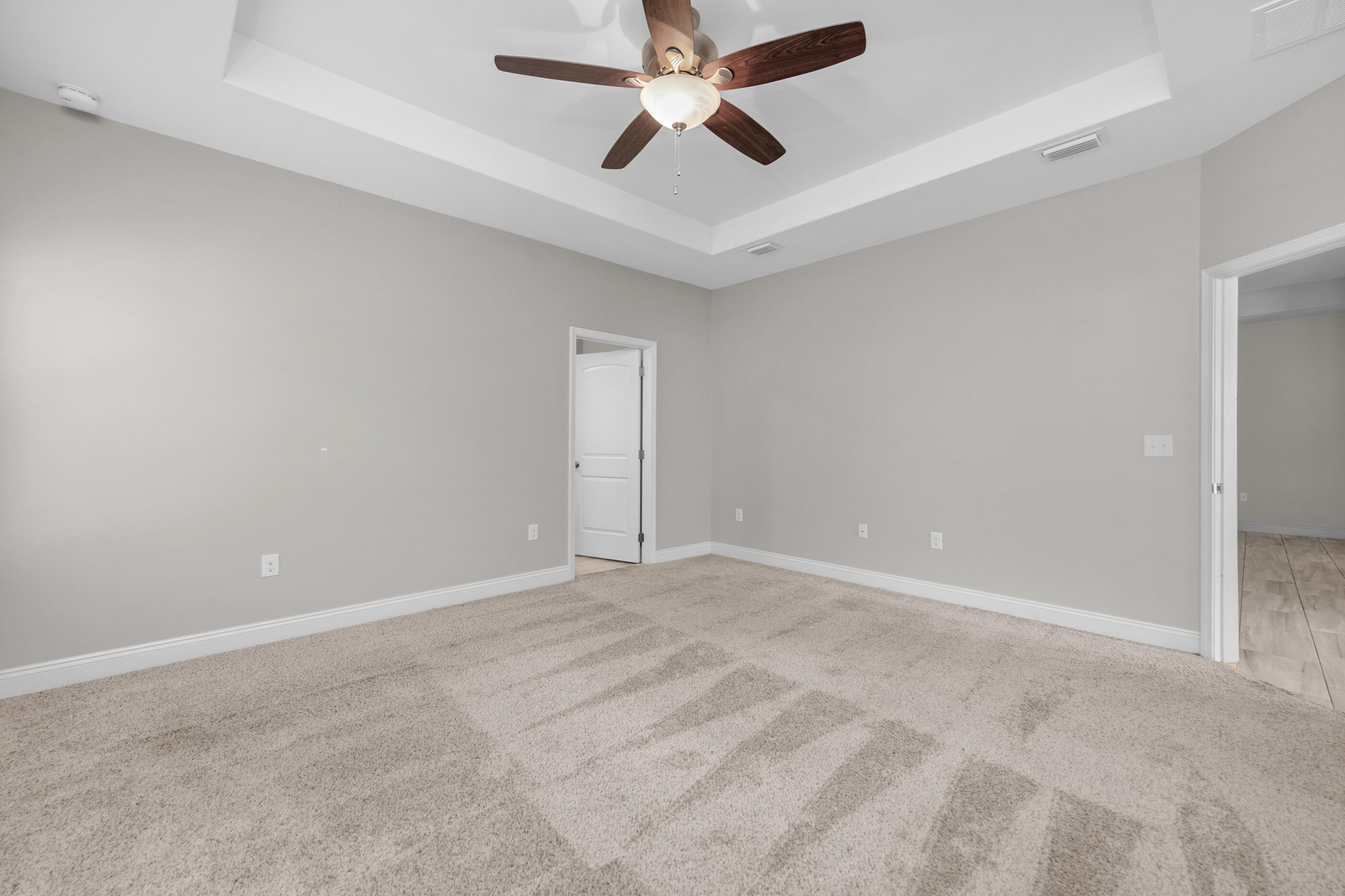 2285 Tom Street Navarre, FL 32566 - Photo 25 of 36 an empty room with chandelier fan