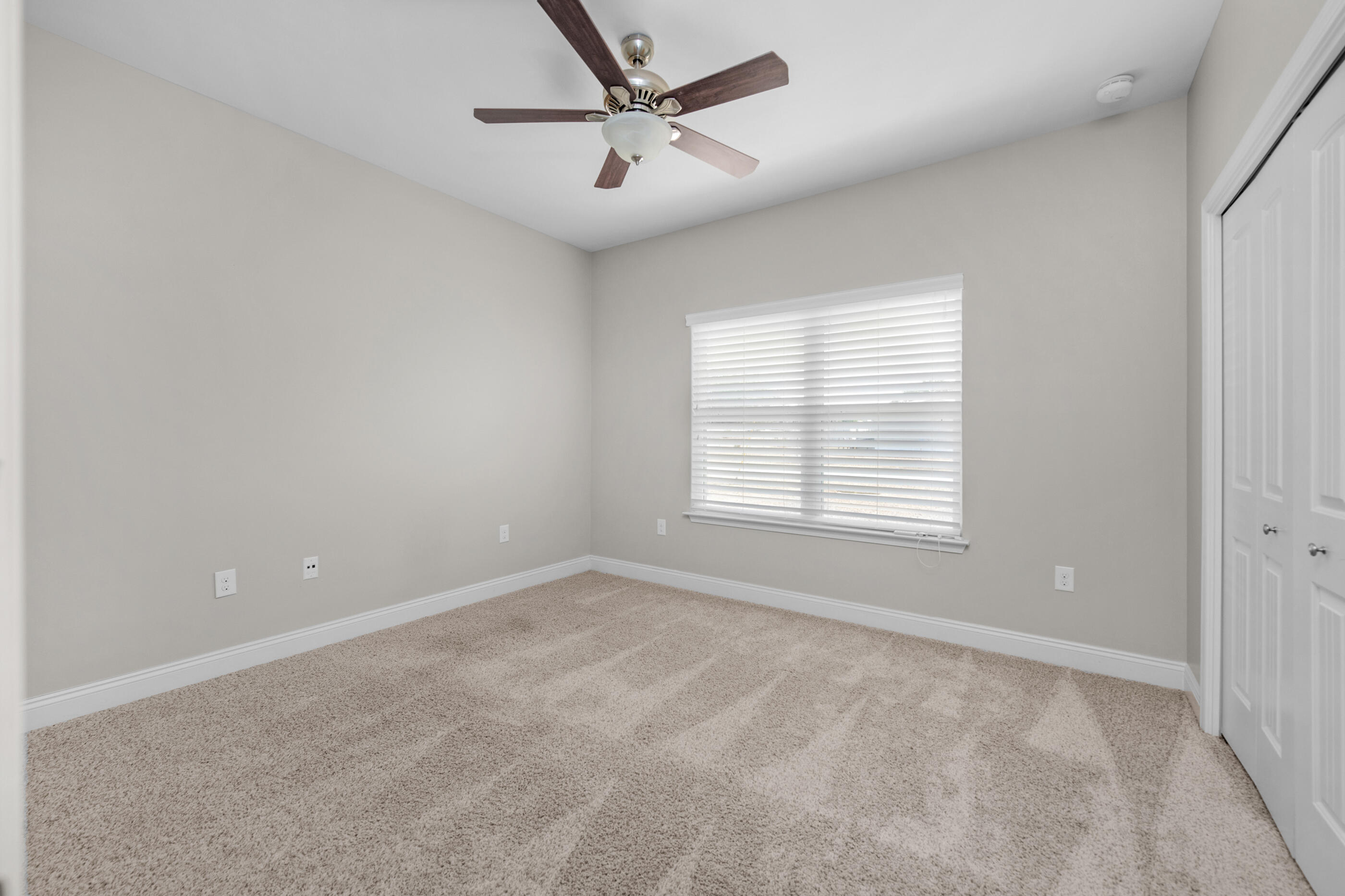 2285 Tom Street Navarre, FL 32566 - Photo 29 of 36 a view of an empty room with a window