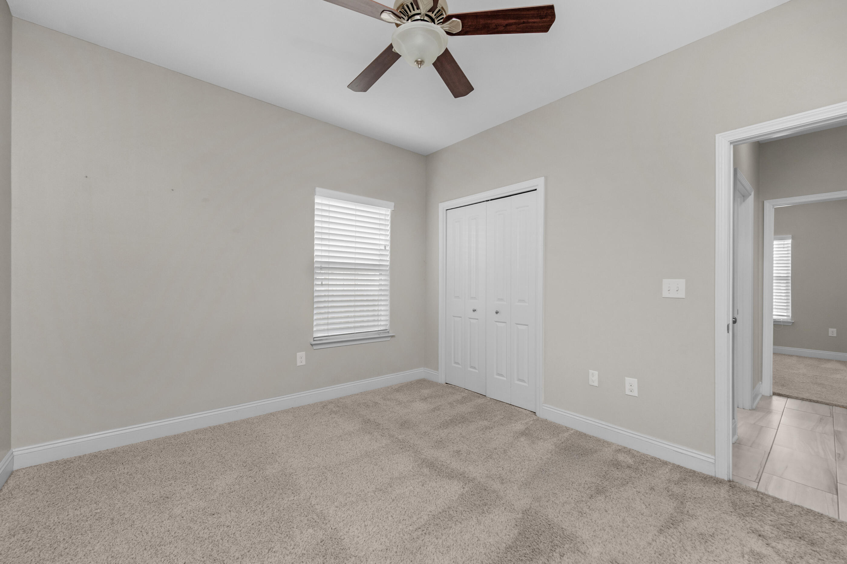 2285 Tom Street Navarre, FL 32566 - Photo 31 of 36 a view of an empty room with a window