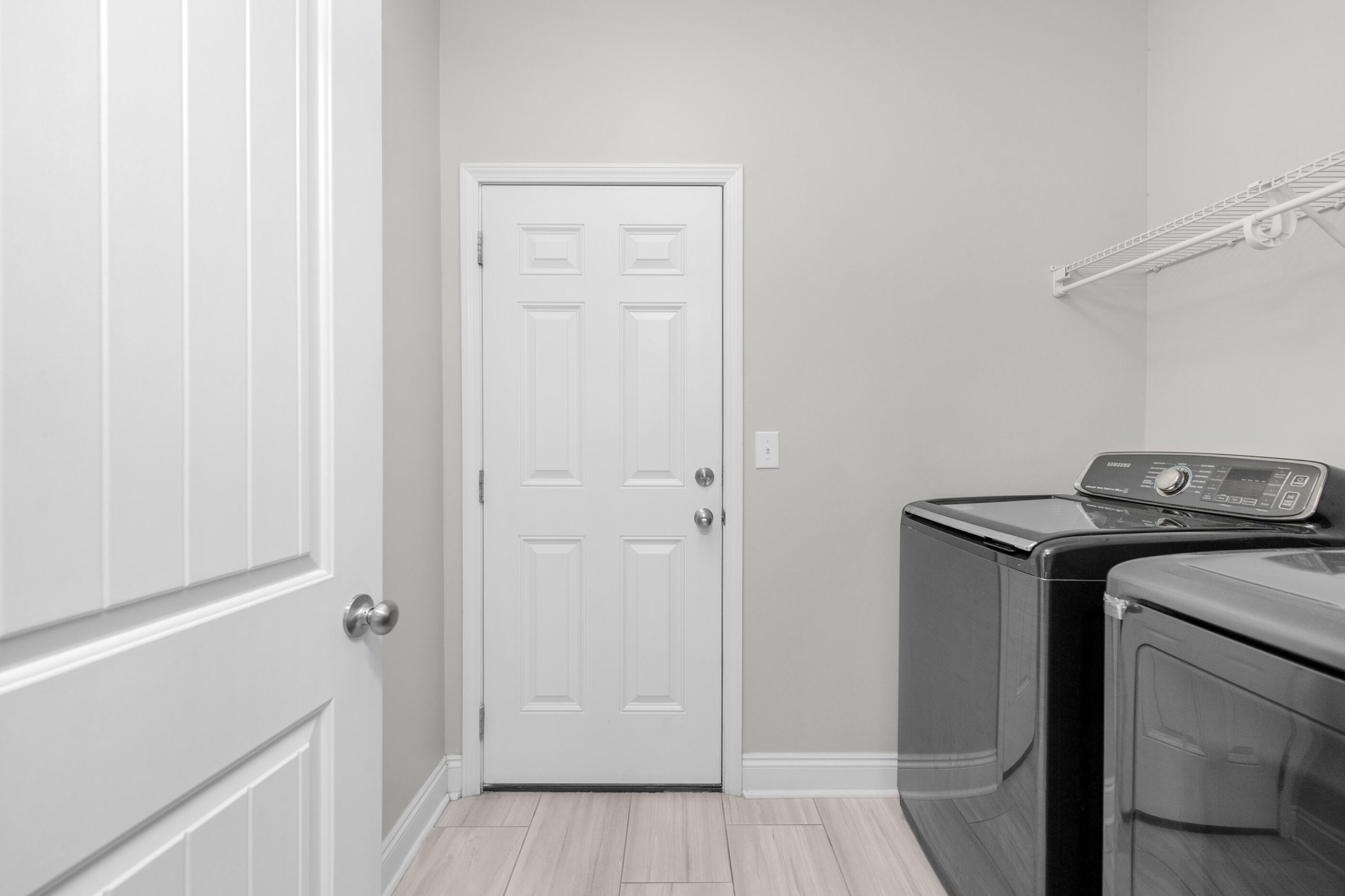 2285 Tom Street Navarre, FL 32566 - Photo 32 of 36 a utility room with sink dryer and washer