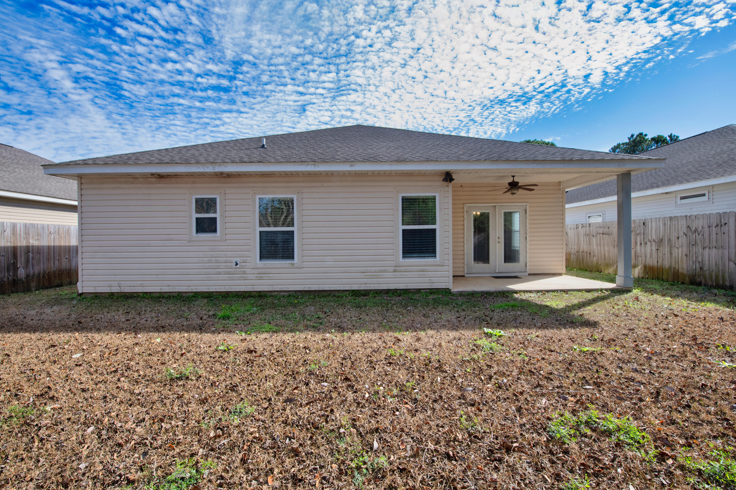 2285 Tom Street Navarre, FL 32566 - Photo 34 of 36 a backyard of a house