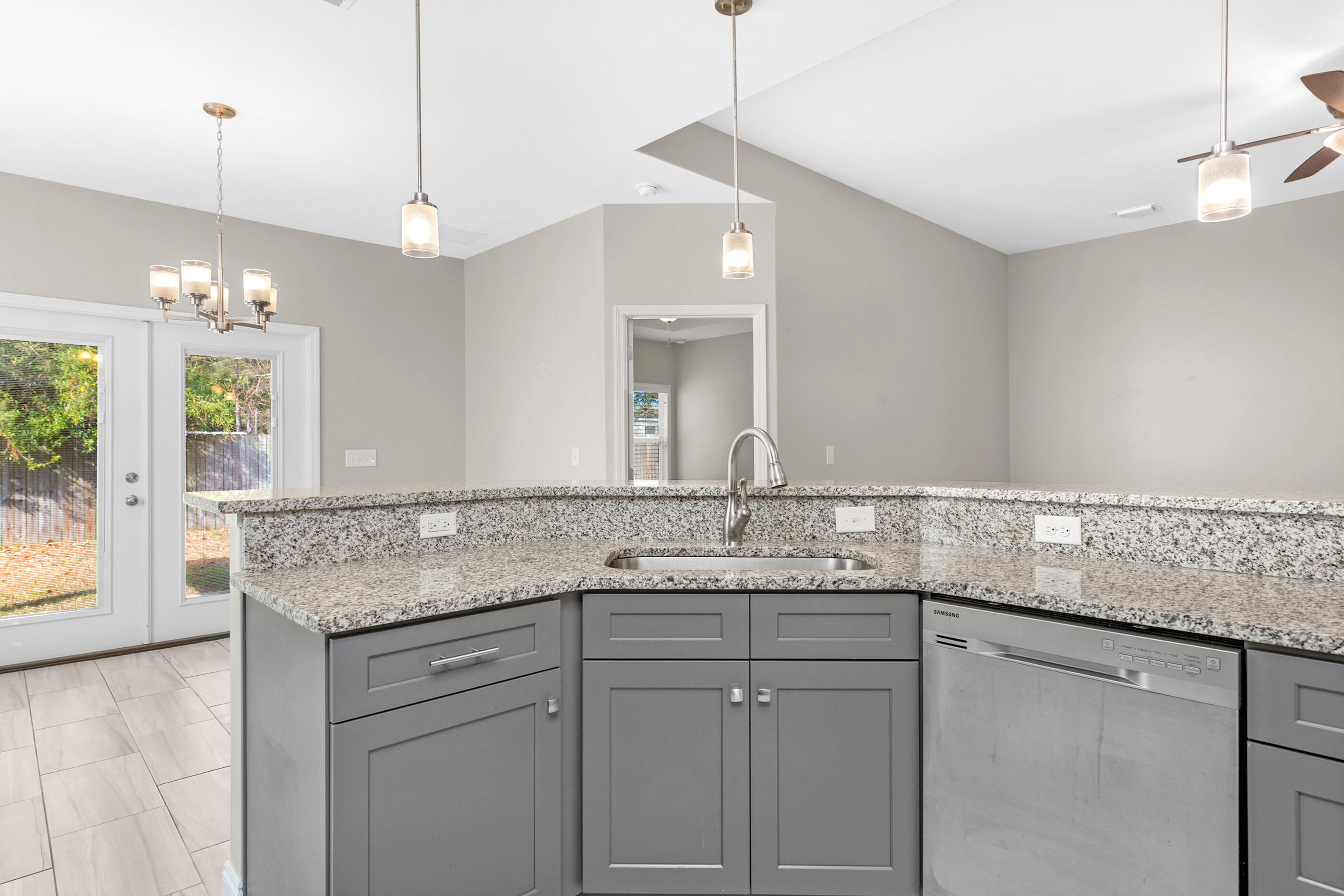 2285 Tom Street Navarre, FL 32566 - Photo 8 of 36 a bathroom with a granite countertop sink a large mirror a vanity and window