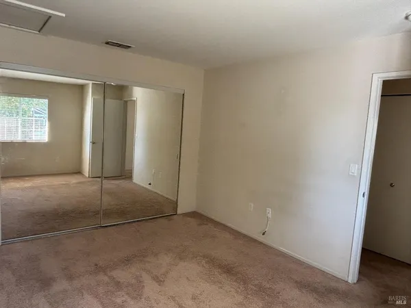 a view of kitchen with cabinets
