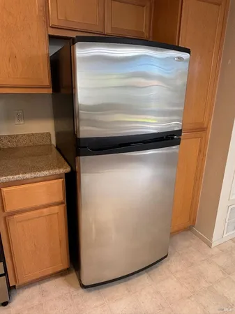 a stove top oven sitting inside of a kitchen