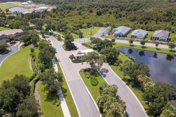 an aerial view of a house with a garden and swimming pool