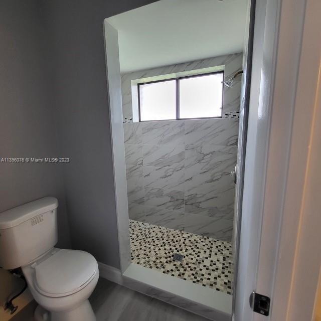 8380 Lords Place, Unit 8380 Boynton Beach, FL 33472 - Photo 13 of 21 a bathroom with a toilet and a shower