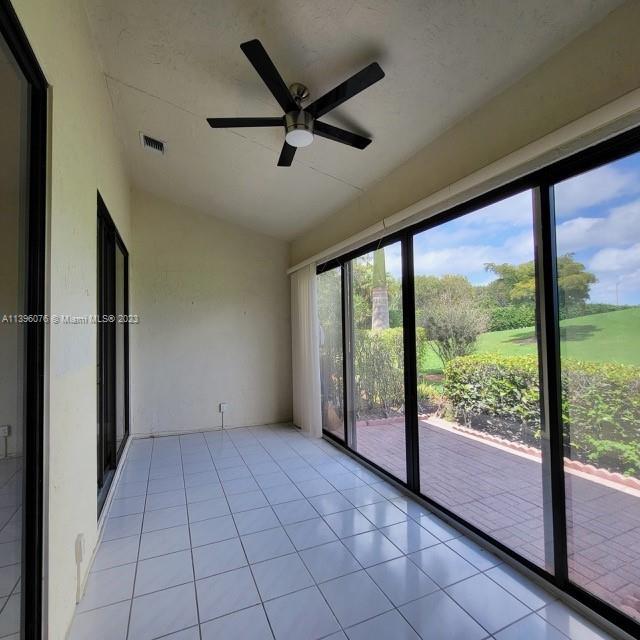 8380 Lords Place, Unit 8380 Boynton Beach, FL 33472 - Photo 18 of 21 a view of an empty room with a window