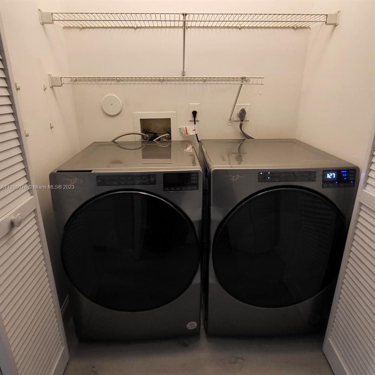 8380 Lords Place, Unit 8380 Boynton Beach, FL 33472 - Photo 21 of 21 a bathroom with a sink and a mirror